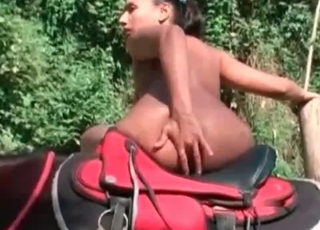 Nude posing on a sexy-ass horse