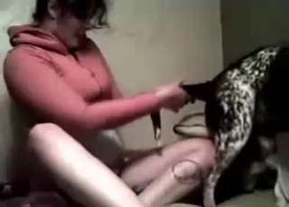 Brunette aggressively seducing a doggo