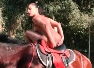 Nude posing on a sexy-ass horse