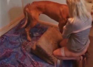 Kinky MILF enjoying dog cock on cam